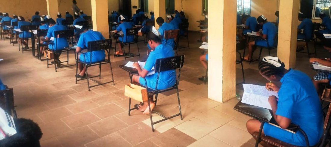 Students of SON Iyienu writing exam