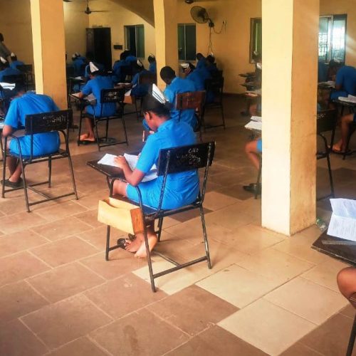 Students of SON Iyienu writing exam