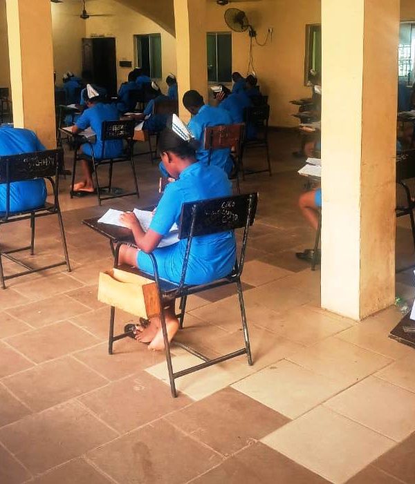 Students of SON Iyienu writing exam
