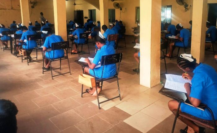 Students of SON Iyienu writing exam