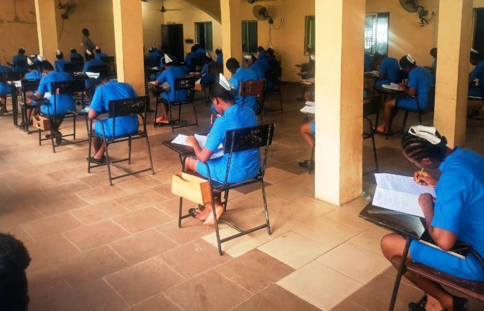 Students of SON Iyienu writing exam