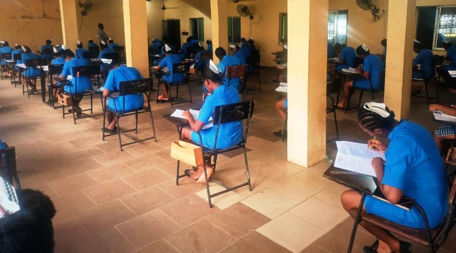 Students of SON Iyienu writing exam